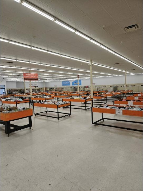 Inside the Deals Outlet Warner Robins store, rows of bins